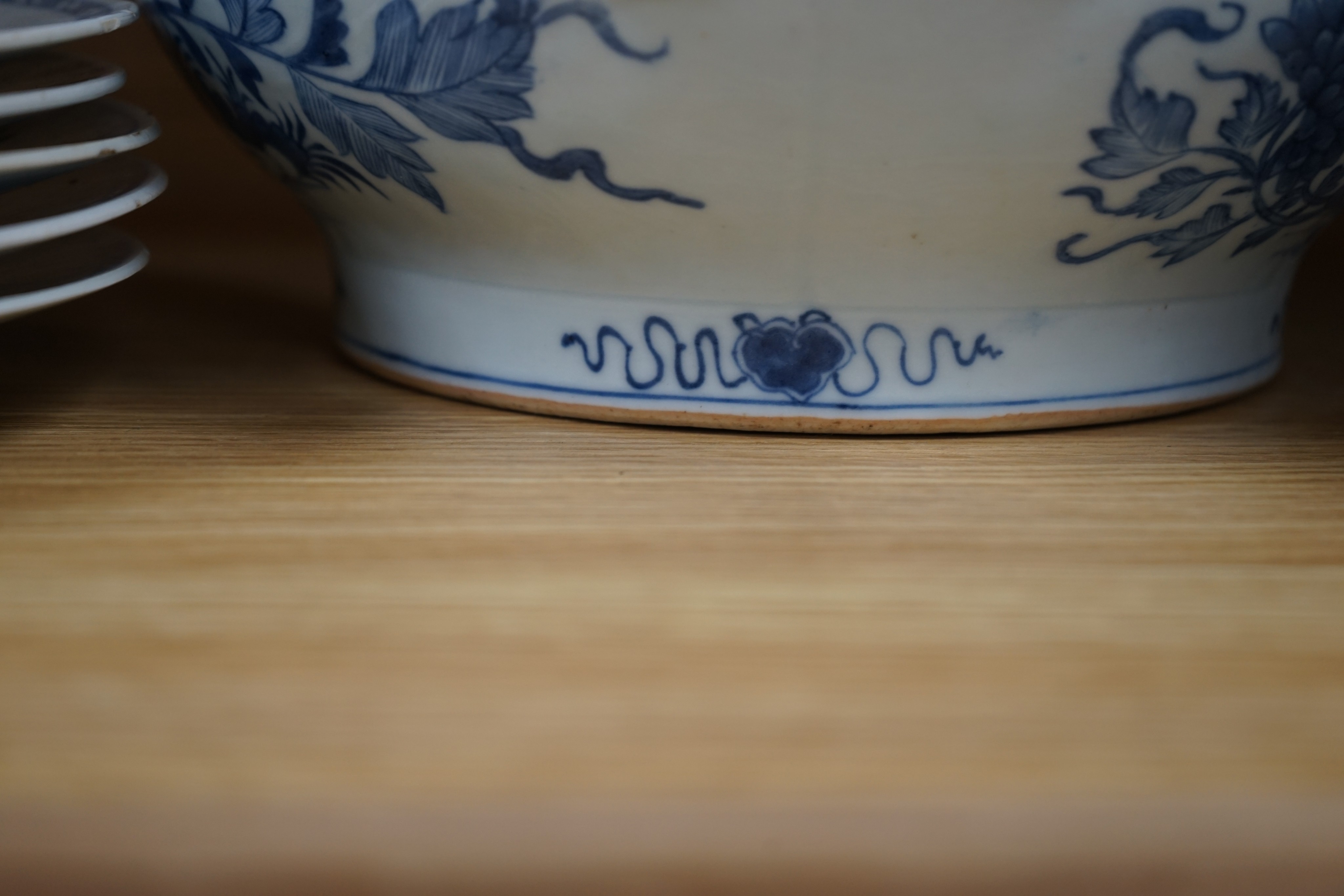 An 18th century Chinese Export blue and white octagonal tureen and cover, decorated with birds and flowers, a pair of similar sauceboats and five plates decorated with urns of flowers